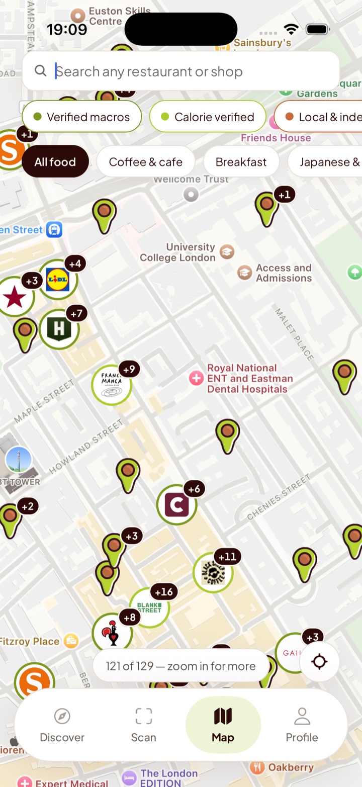 The map screen in central London with brand pins, cuisine filters and a search bar